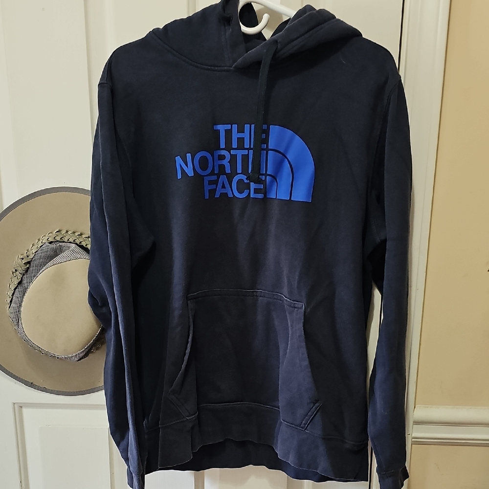 The North Face Dark Hoodie with Vibrant Blue Logo